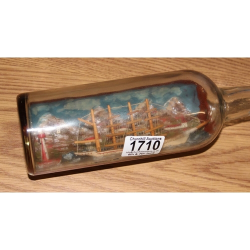 1710 - A vintage ship in bottle model, likely early 20th century