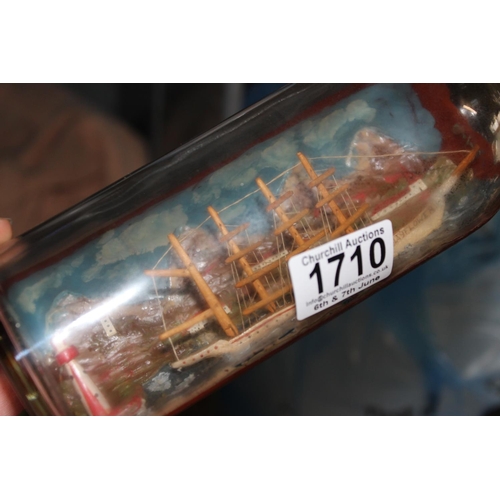 1710 - A vintage ship in bottle model, likely early 20th century