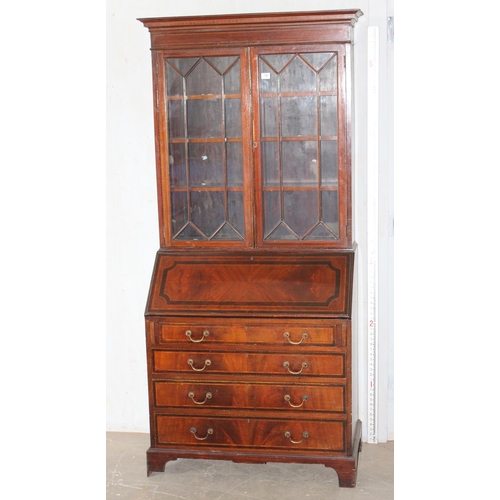 18 - An antique bureau bookcase with glazed top and brass drop handles