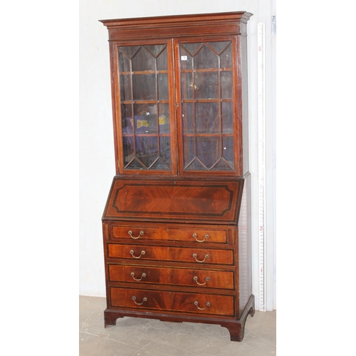 18 - An antique bureau bookcase with glazed top and brass drop handles