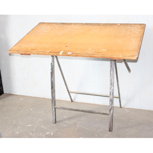 20 - A 1955 dated draftsman's table on adjustable metal stand