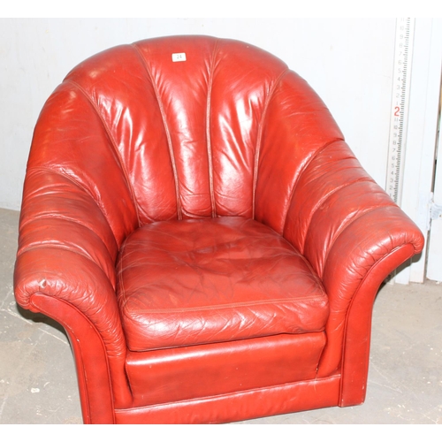 24 - A 20th century Art Deco style shell shaped club armchair, red leather or leatherette by Tetrad