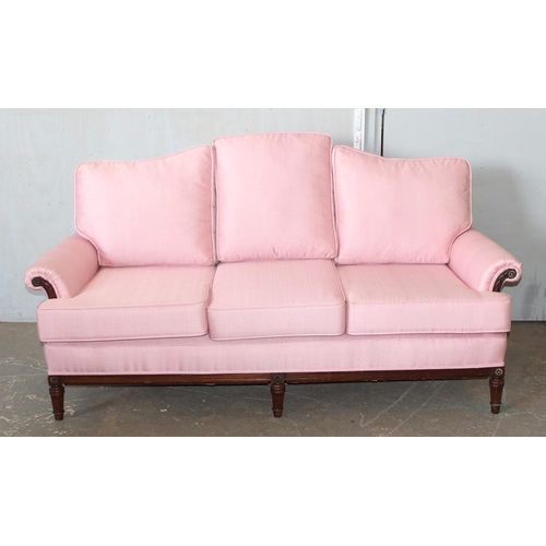 3 - A Regency style deep seated 3 seater sofa with light pink upholstery standing on reeded legs