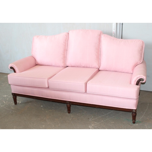 3 - A Regency style deep seated 3 seater sofa with light pink upholstery standing on reeded legs