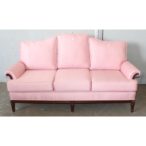 3 - A Regency style deep seated 3 seater sofa with light pink upholstery standing on reeded legs