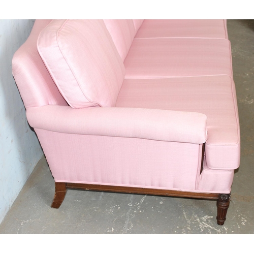 3 - A Regency style deep seated 3 seater sofa with light pink upholstery standing on reeded legs