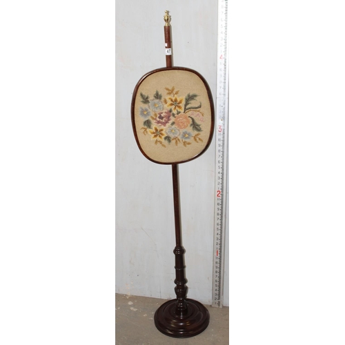 47 - An antique mahogany pole screen with tapestry panel