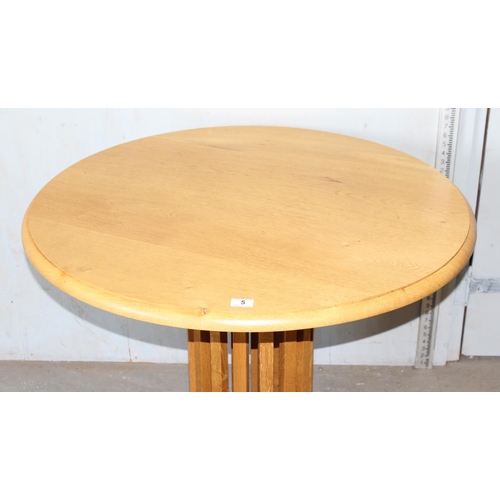 5 - An unusual light oak pedestal table with slatted wooden support