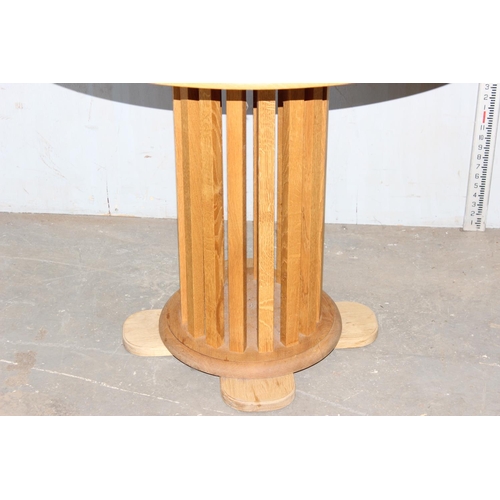 5 - An unusual light oak pedestal table with slatted wooden support