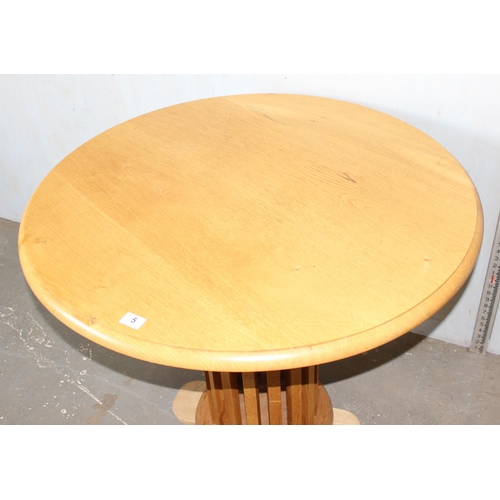 5 - An unusual light oak pedestal table with slatted wooden support