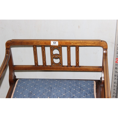 51 - An Edwardian piano stool with strung inlay standing on spade legs