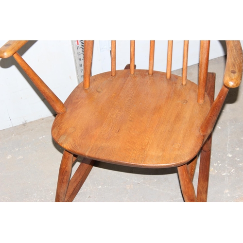 53 - A vintage hoop backed rocking chair, likely Ercol but unmarked