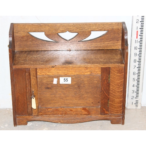 55 - An arts & crafts period oak wall cupboard