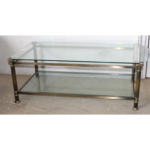 59 - Retro glass topped coffee table with column supports