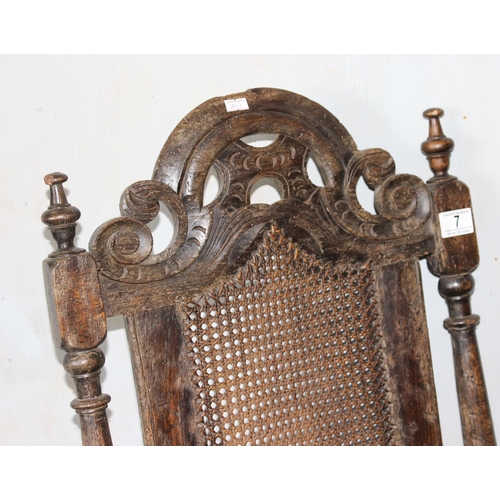 7 - A mid - late 17th century Carolean carved walnut chair, with caned seat and back