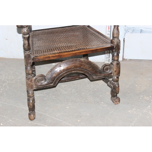 7 - A mid - late 17th century Carolean carved walnut chair, with caned seat and back