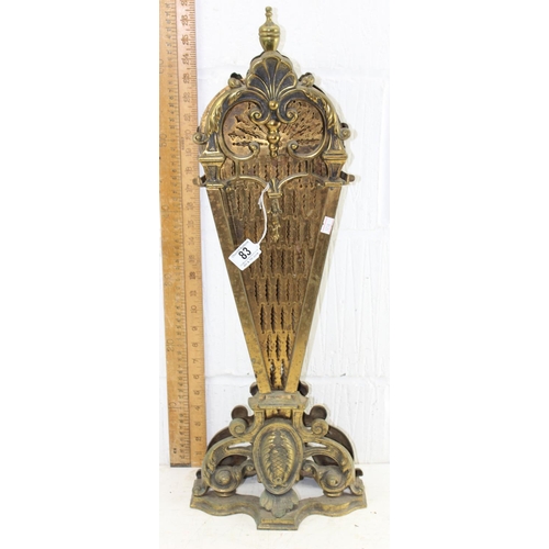 83 - An early 20th century folding brass peacock fire screen