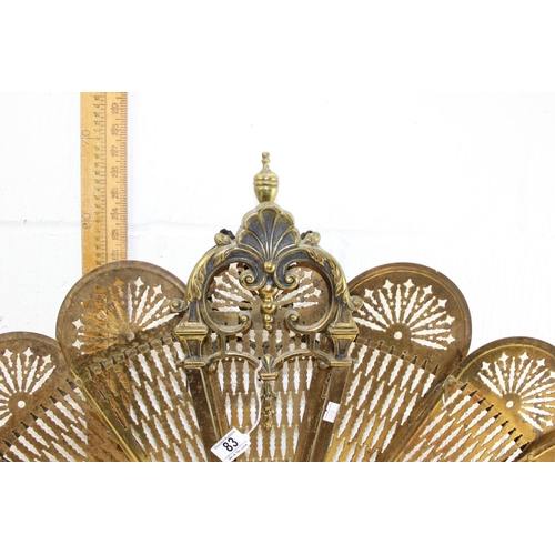 83 - An early 20th century folding brass peacock fire screen