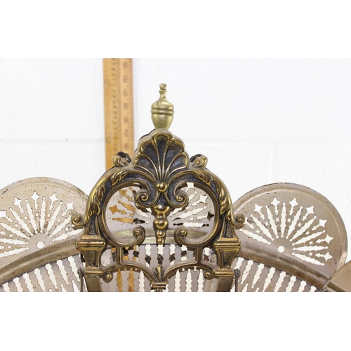 83 - An early 20th century folding brass peacock fire screen