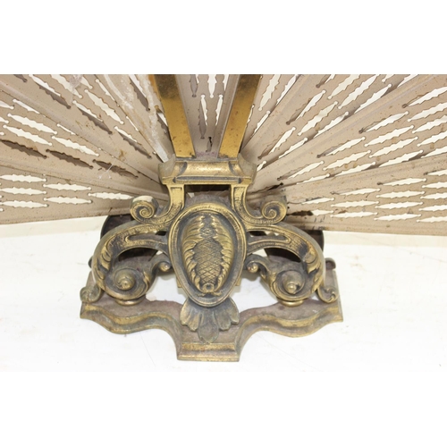 83 - An early 20th century folding brass peacock fire screen