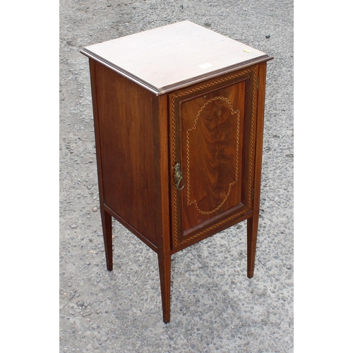 86 - An Edwardian Sheraton style cupboard on legs