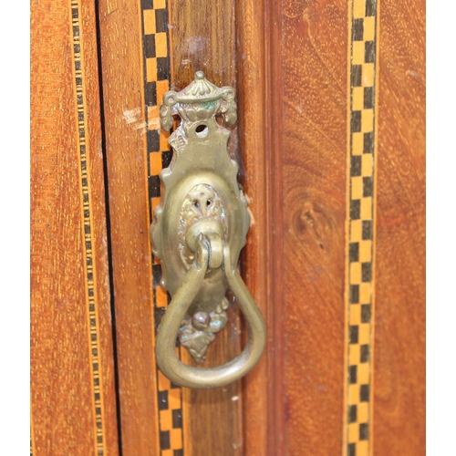 86 - An Edwardian Sheraton style cupboard on legs