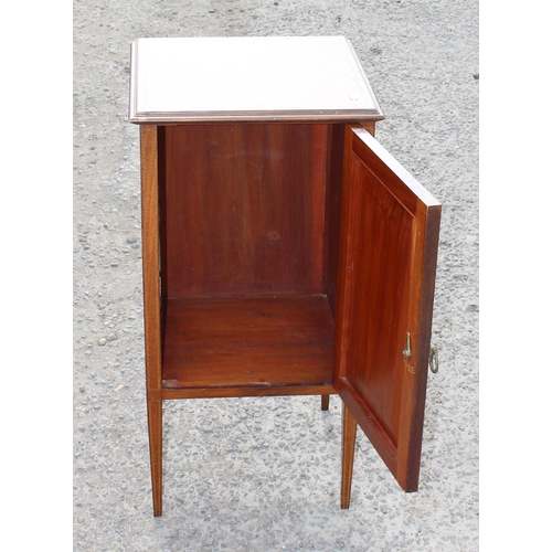 86 - An Edwardian Sheraton style cupboard on legs