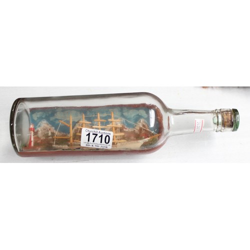 1710 - A vintage ship in bottle model, likely early 20th century