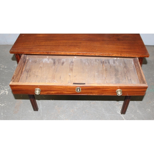 23 - 19th century mahogany foldover tea table with brass handle and drawer