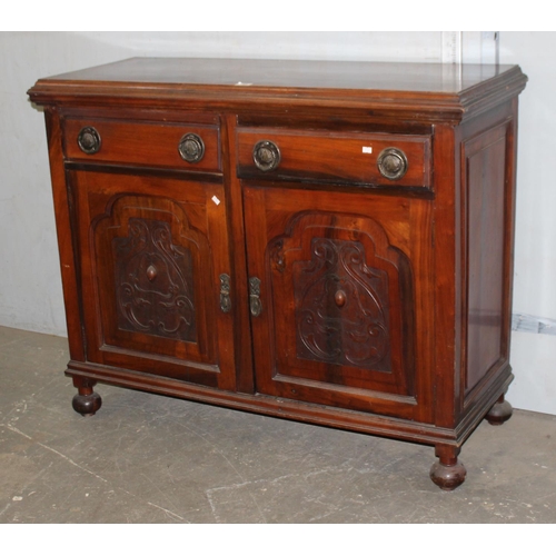 38 - An early 20th century carved sideboard in the Art Nouveau style with metal handles, by McIlroy of Re... 