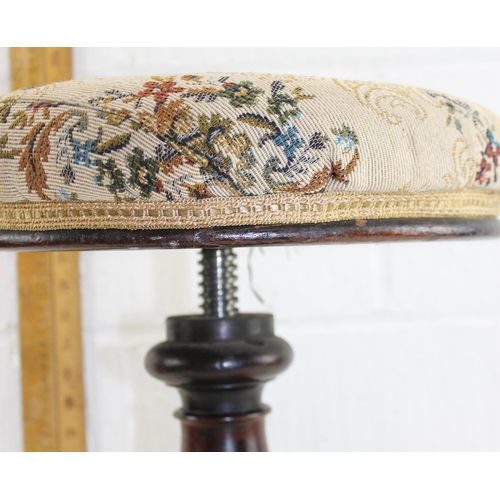 121 - Antique mahogany rise and fall piano stool with carved details