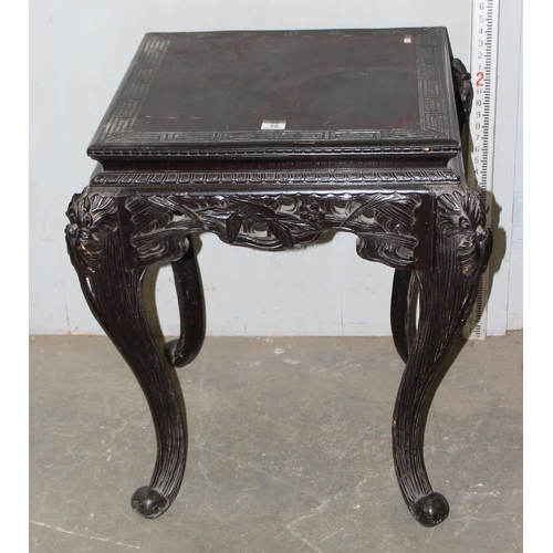 56 - Chinese ebonised wooden side table with highly carved details