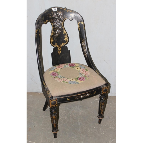 60 - A Victorian black japanned papier mache spoon back chair with pierced back splat, drop in upholstere... 