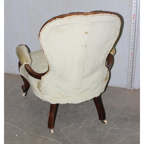 63 - A Victorian upholstered button back nursing chair
