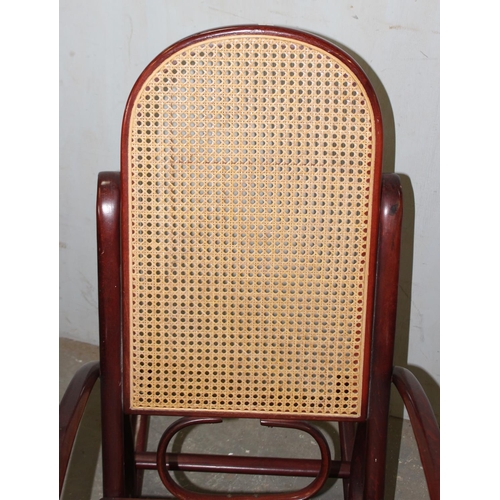 69 - A vintage Thonet style bentwood rocking chair with Bergere seat and back