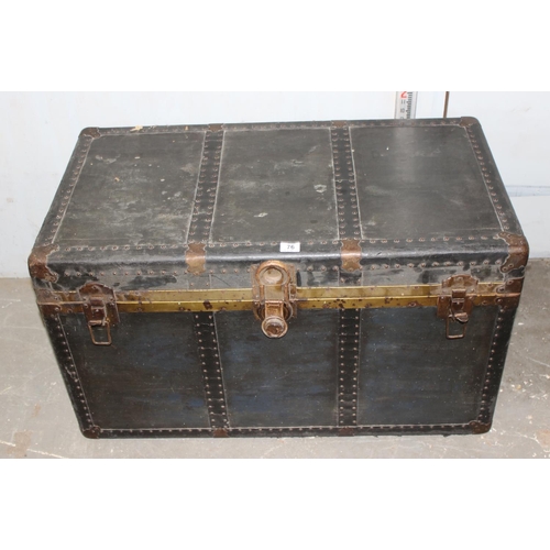 76 - A large vintage black painted shipping trunk