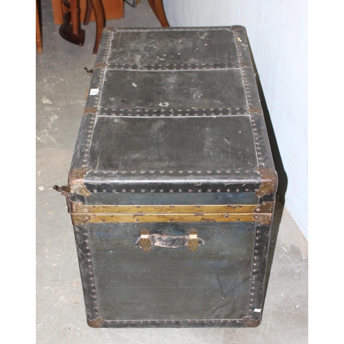 76 - A large vintage black painted shipping trunk