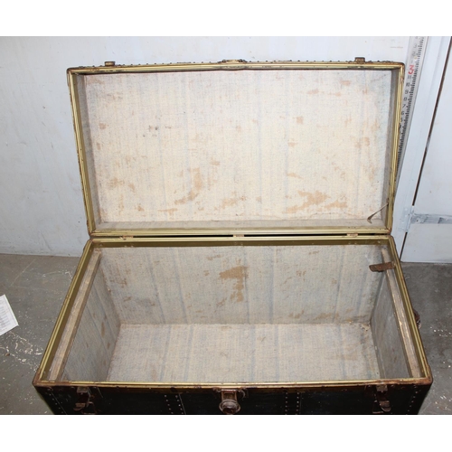 76 - A large vintage black painted shipping trunk