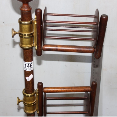 146 - A Victorian mahogany wool winder on turned base, with brass fittings