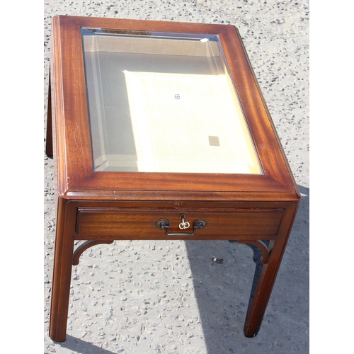 150 - Glass topped display table with key