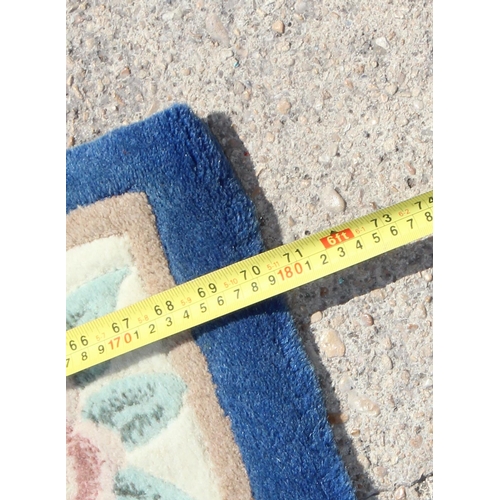 210 - Royal blue & cream ground rug