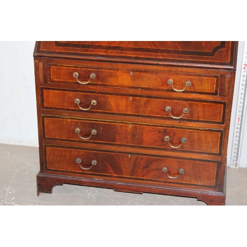 183 - An antique bureau bookcase with glazed top and brass drop handles