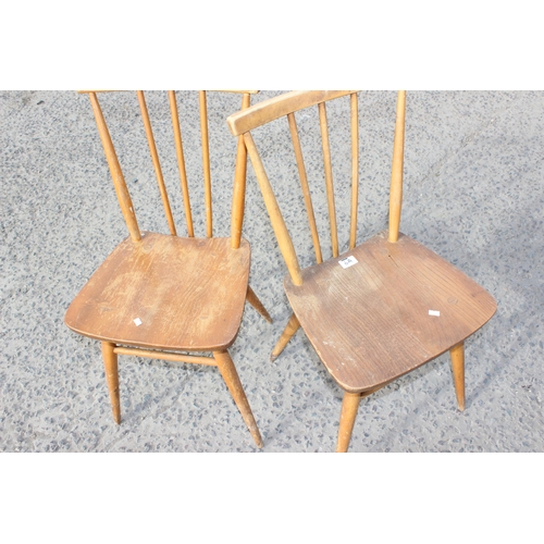 8A - A pair of blonde Ercol candlestick chairs