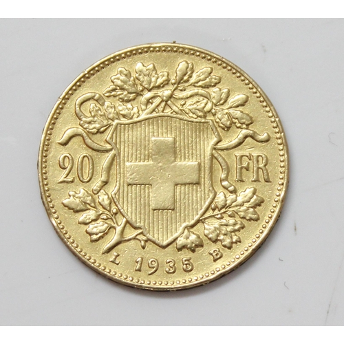 1336 - Coins, Switzerland, a 20 Franc gold coin dated 1935, approx 6.6g gross weight, approx 21mm diameter,... 