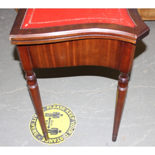 151 - 2 drawer leather topped twist top tea table