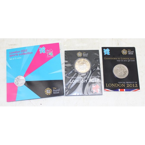 1341 - A Royal Mint London 2012 50p 5 coin set & 2 Olympic £5 coins, all in original packaging