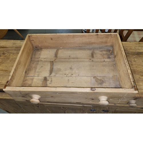 133 - Antique stripped pine dresser base with 3 drawers over 2 cupboards