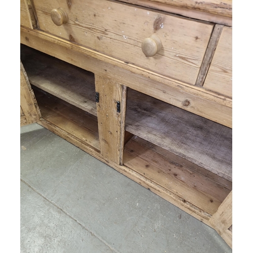 133 - Antique stripped pine dresser base with 3 drawers over 2 cupboards