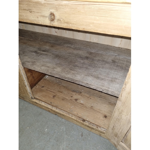 133 - Antique stripped pine dresser base with 3 drawers over 2 cupboards