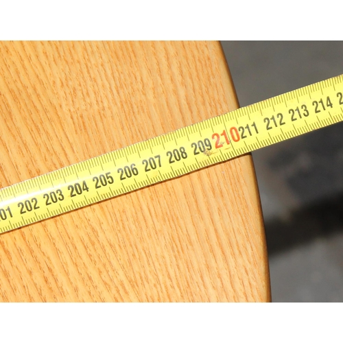 21A - A vintage blonde Ercol extending dining table